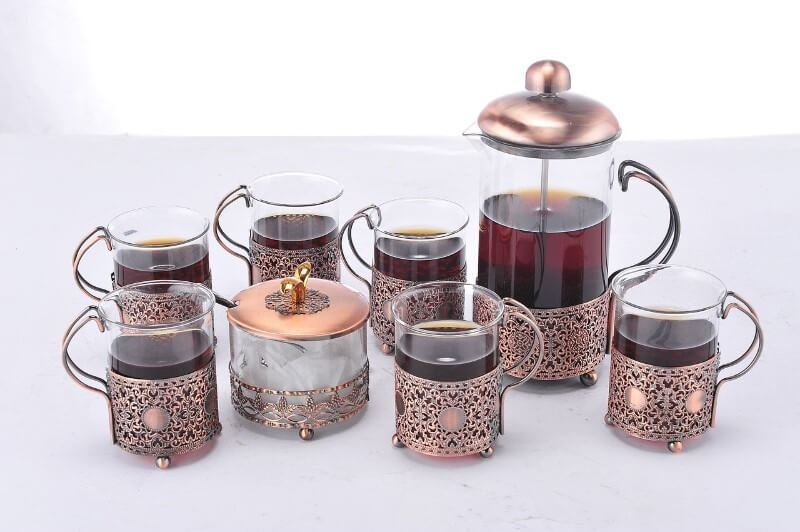 french press coffee maker with filled coffee cups