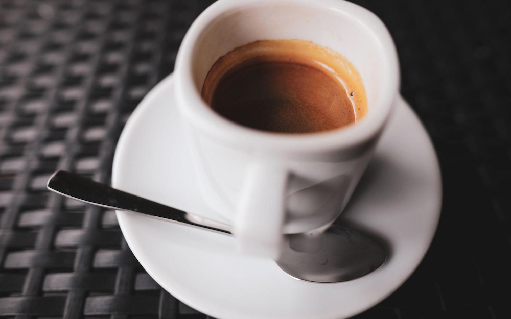 How does the espresso machine influence barista workflow?
