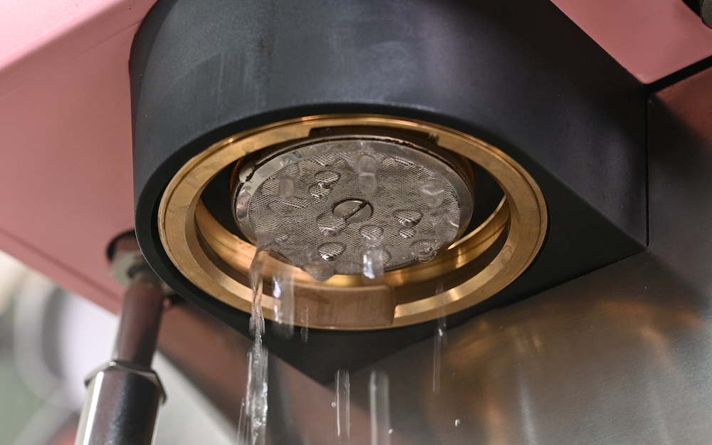 Running water through Rancilio Silbia Pro X espresso machine.