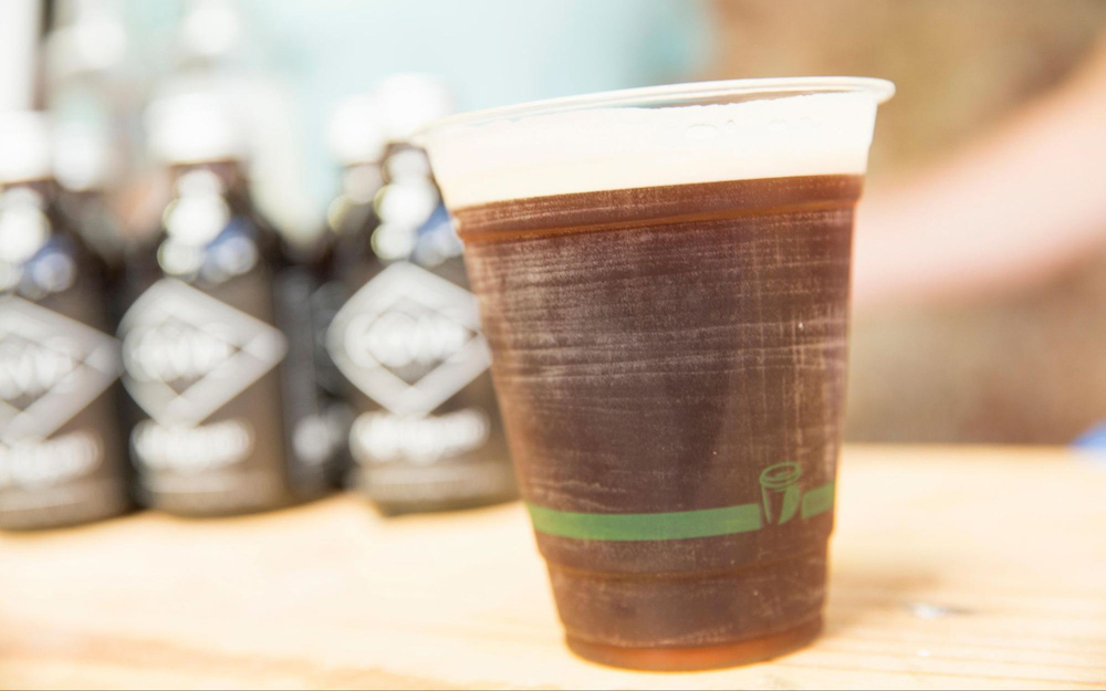 A takeaway cup of aged nitro cold brew.