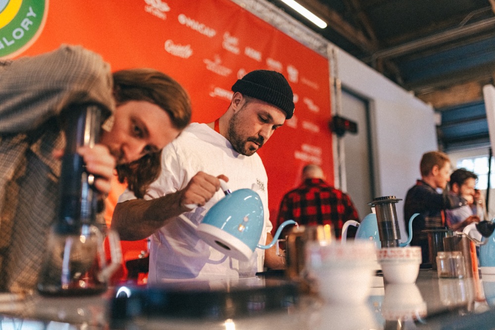 Baristas brew coffee at the 2022 World AeroPress Championship in Vancouver BC, Canada.