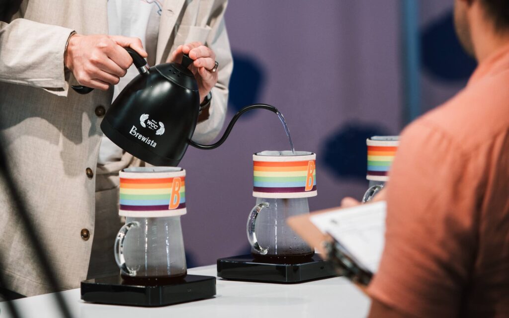 Erik Freudenberg brews coffee during his 2023 World Brewers Cup routine.