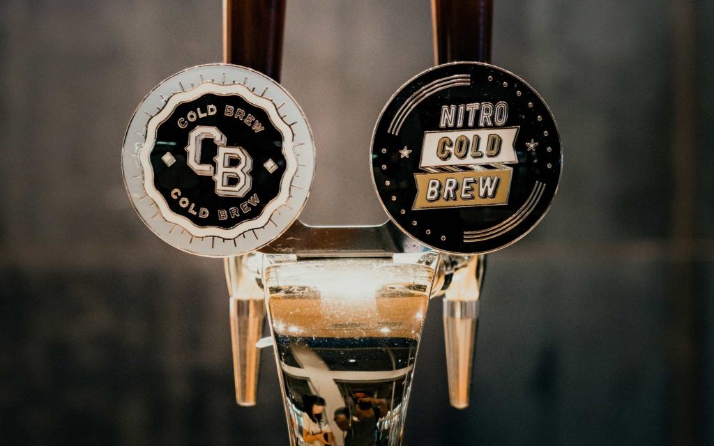 An example of nitro cold brew coffee taps at a bar.