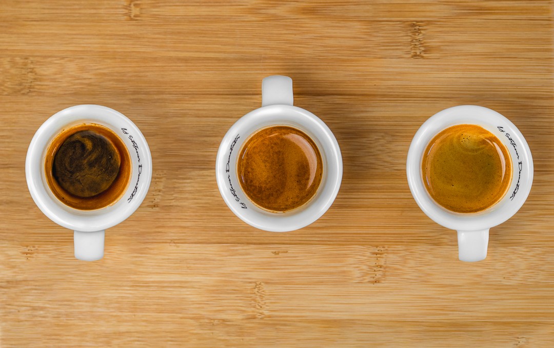 Three espressos in white ceramic cups.